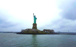 View of the Statue of Liberty from the ferry ride, for Ellen Blazer's travel blog To Travel and Bloom