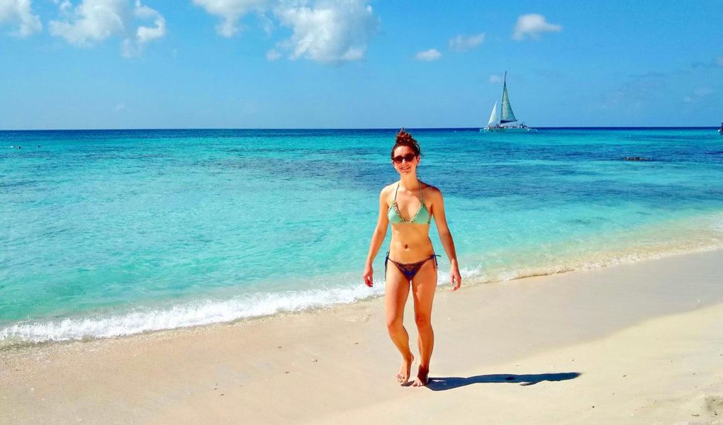 Ellen on Palm Beach of Aruba for Ellen Blazer's travel blog To Travel and Bloom