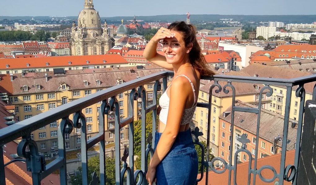 Ellen looking over Dresden, Germany from the bell tower of Kreuzkirche Cathedral, for Ellen Blazer's travel blog To Travel and Bloom