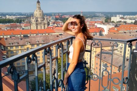 Ellen looking over Dresden, Germany from the bell tower of Kreuzkirche Cathedral, for Ellen Blazer's travel blog To Travel and Bloom