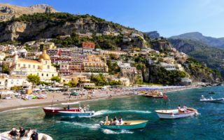 View of the Amalfi Coast by boat, for Ellen Blazer's travel blog To Travel and Bloom